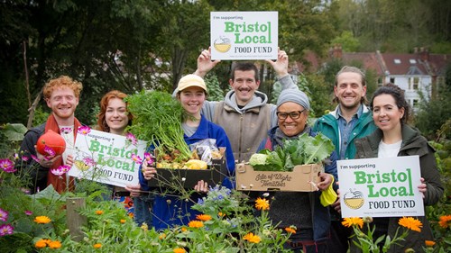 bristol local food fund supporters with locally grown vegetables and placards