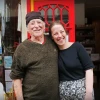 Van and his daughter Rosie smiling outside the shop