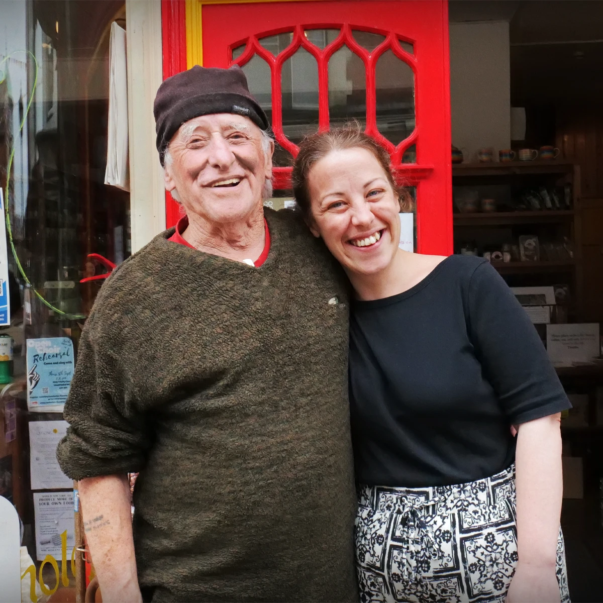 Van and his daughter Rosie smiling outside the shop