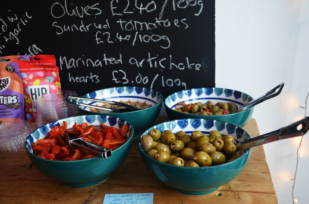 Selection of fresh antipasti for sale in store served in bowls