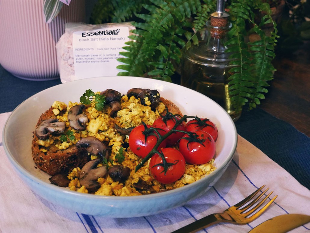 Scrambled Tofu Breakfast served with tomatoes and mushrooms