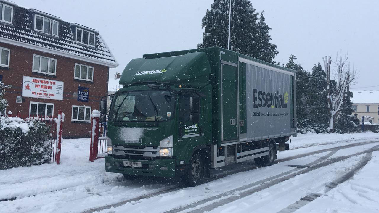 An Essential truck delivering in the snow